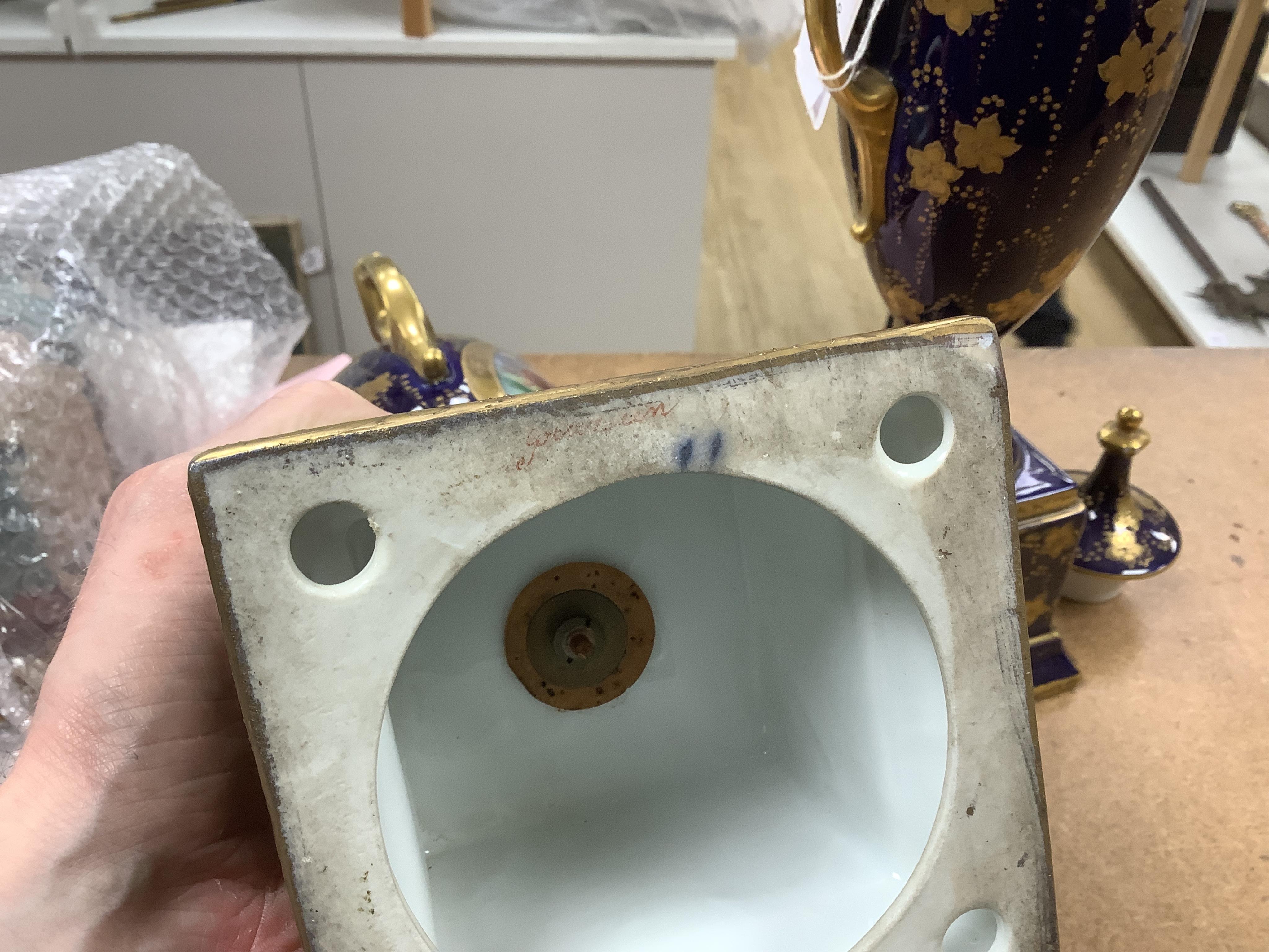 A pair of early 20th century Vienna style porcelain urns and covers, 36cm